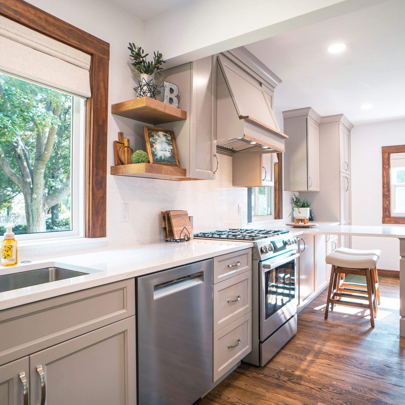 Modern kitchen remodel with white cabinets and marble countertops
